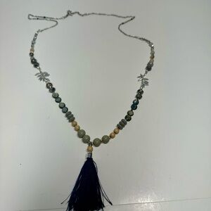 Tassel pendant necklace with wood and ceramic beads. Lobster claw clasp